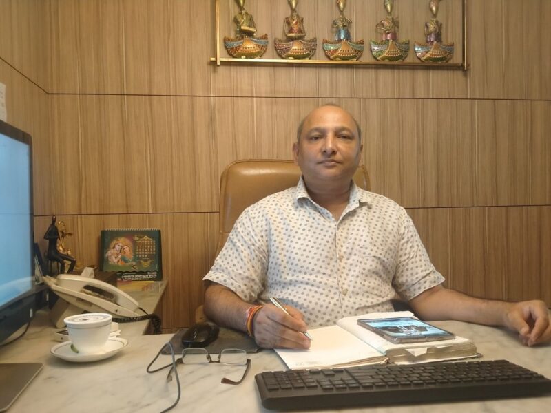 EXPERT MATCHFINDER: Gupta Ji in his office and the front of his office at Shakti Nagar