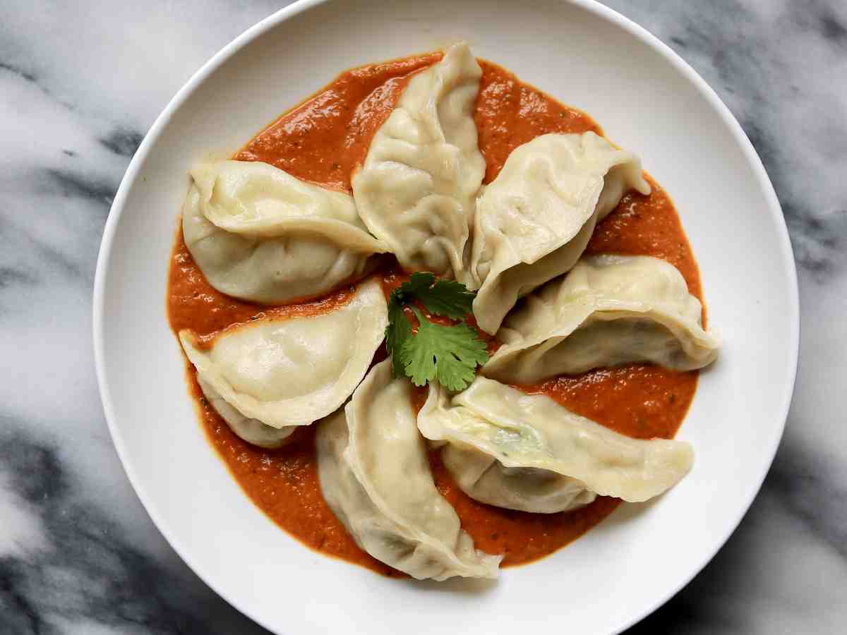 Butter Chicken Momos: Stuffed with shredded butter chicken for a rich, buttery taste