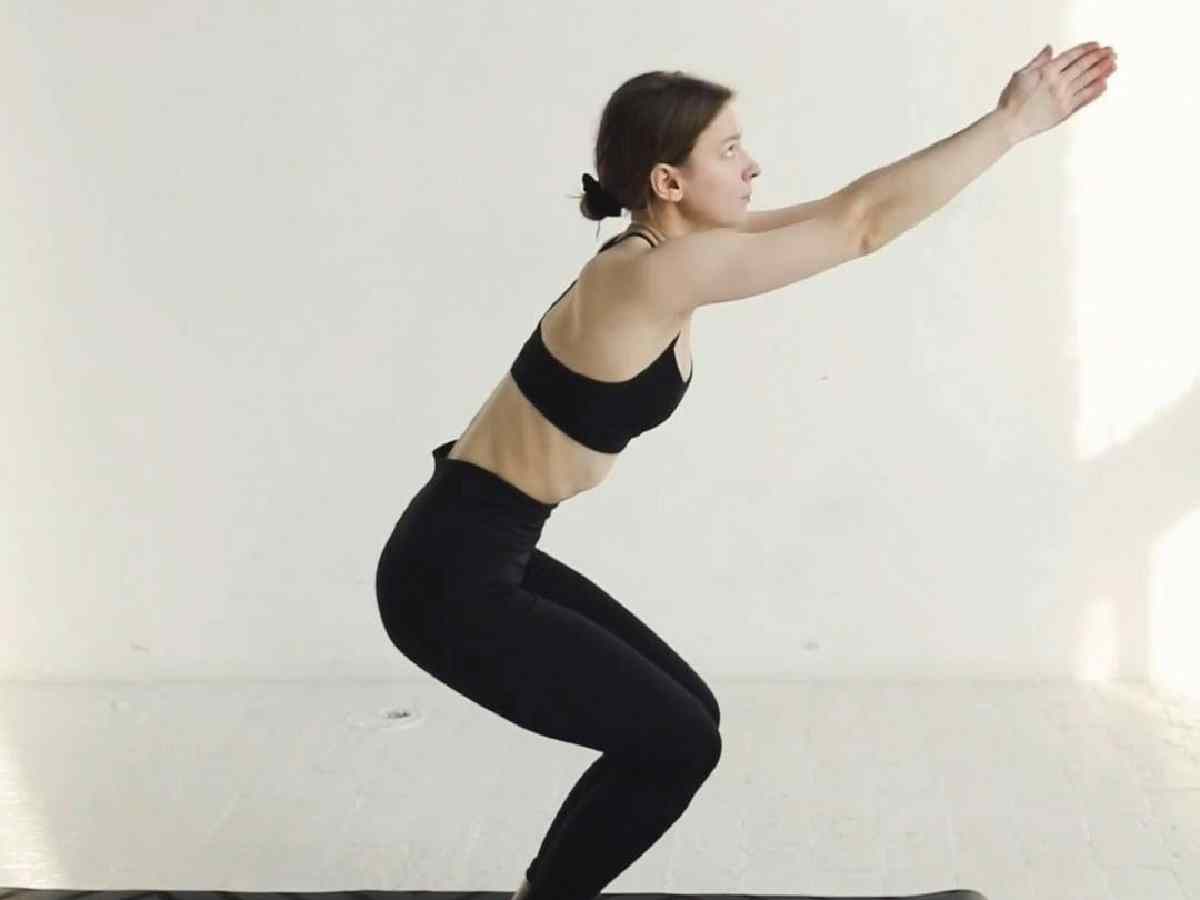 Chair Pose (Utkatasana) - Engages multiple muscle groups, increasing heart rate and boosting metabolism.