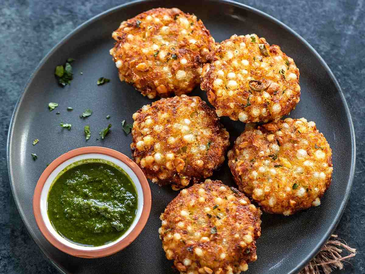 Sabudana Vada is crispy on the outside and soft on the inside, making it perfect for snacks. Start by mixing soaked sabudana, mashed potatoes, crushed peanuts, green chilies, cumin seeds, and salt. Form the mixture into small patties. Heat oil in a pan and deep fry the patties until they are golden brown. Serve these delicious vadas with mint chutney or ketchup.