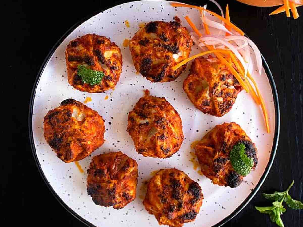 Tandoori Momos: Grilled after being marinated in tandoori spices for a smoky, spicy flavour