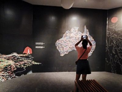 Visitors enjoy art by Australian indigenous communities