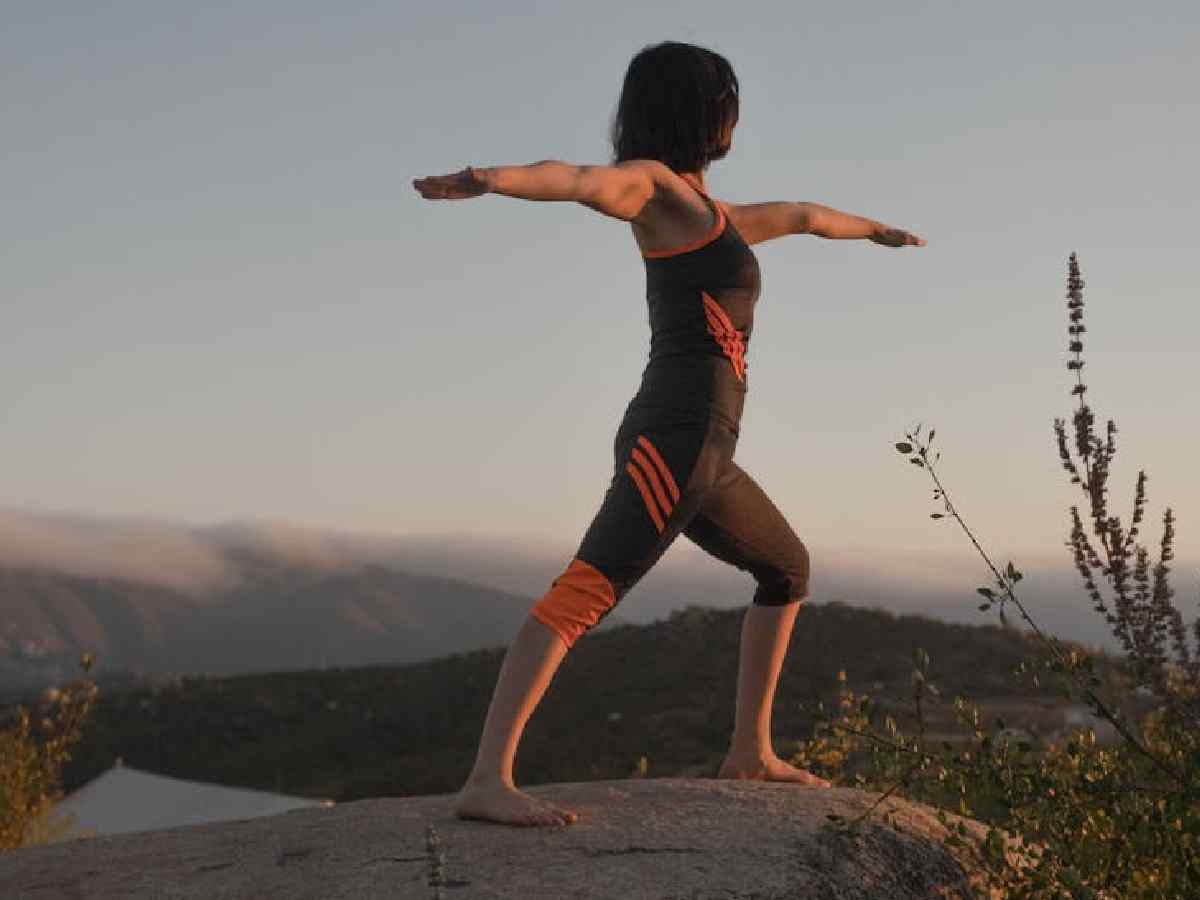 Warrior II Pose (Virabhadrasana II) - Builds strength and stamina, increasing overall energy expenditure and metabolic rate.