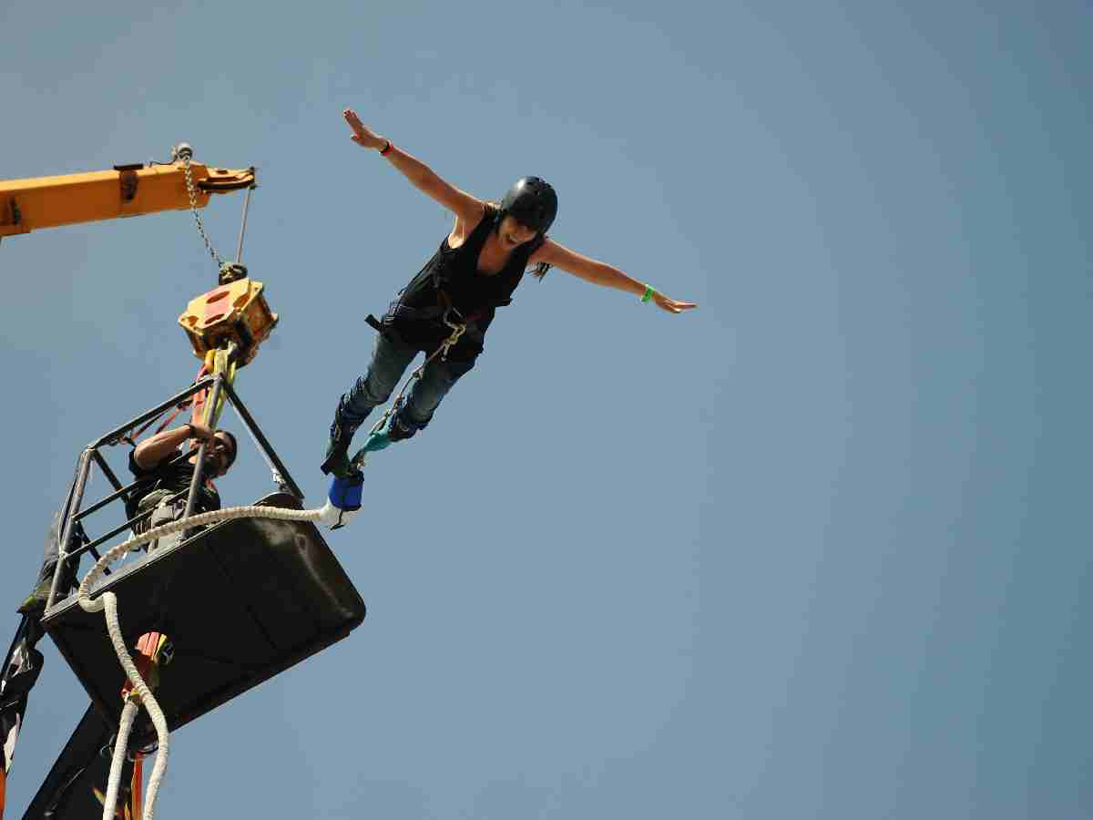 Bungee Jumping: Leaping from a high platform with a bungee cord attached to your ankles. It’s a short but intense free-fall experience.