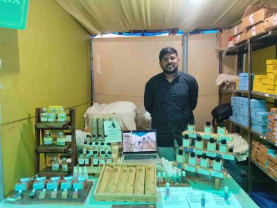 Paresh from Hathras, Uttar Pradesh, selling natural perfumes at the mela