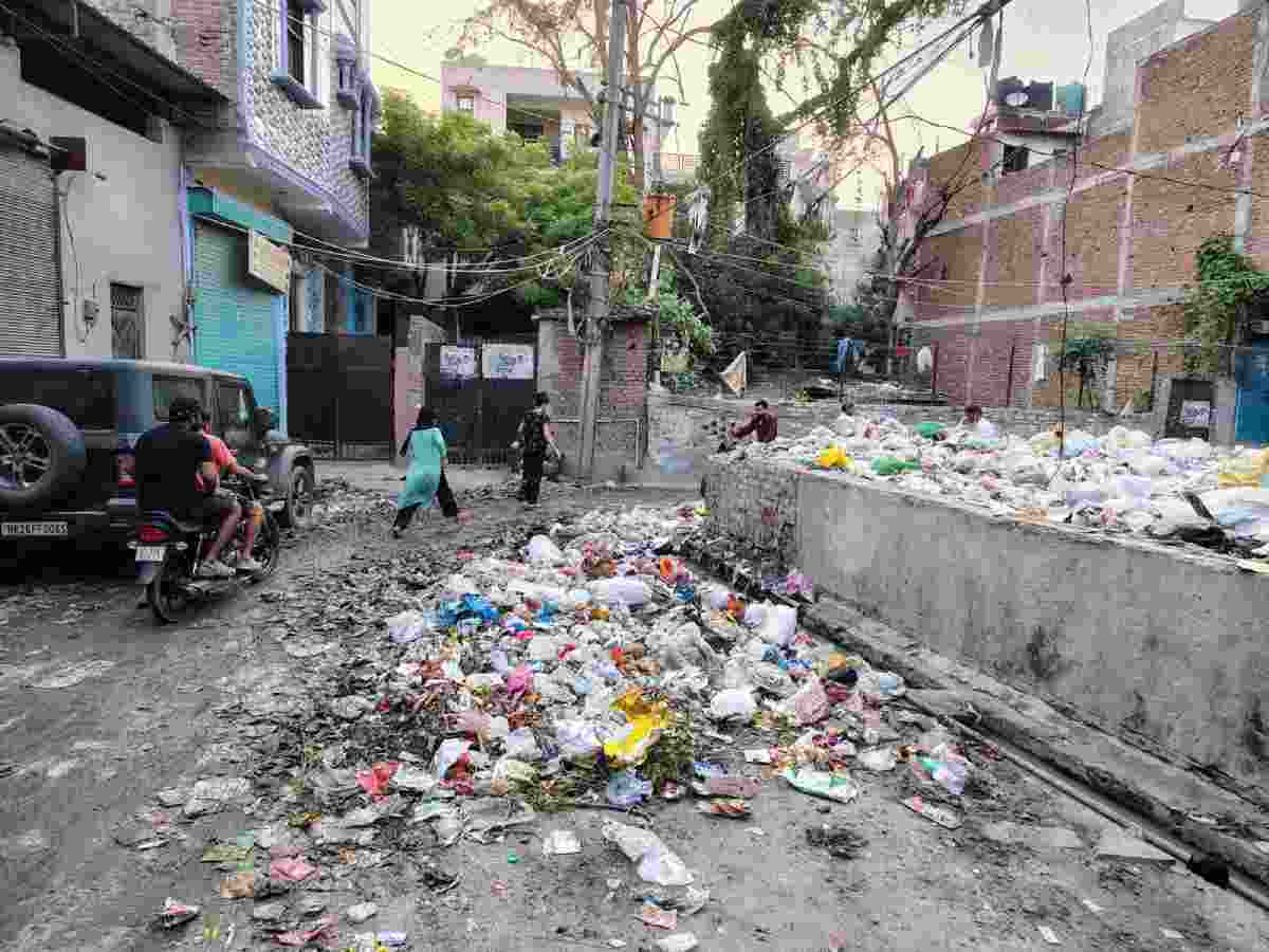 ‘We are living in a dumpyard’: mounting waste sets off alarm bells in Sangam Vihar