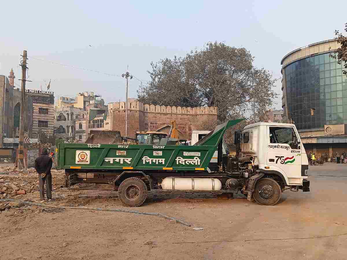 An MCD truck loading debris from the demolition site