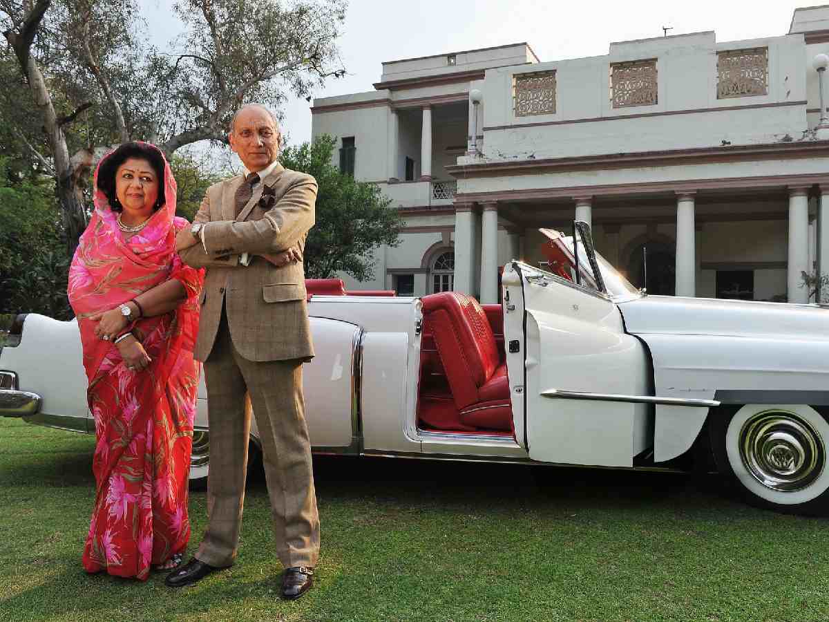Maharaja of Tehri-Garhwal (R) and Maharani of Tehri-Garhwal (L) pose in front of their palatial home
