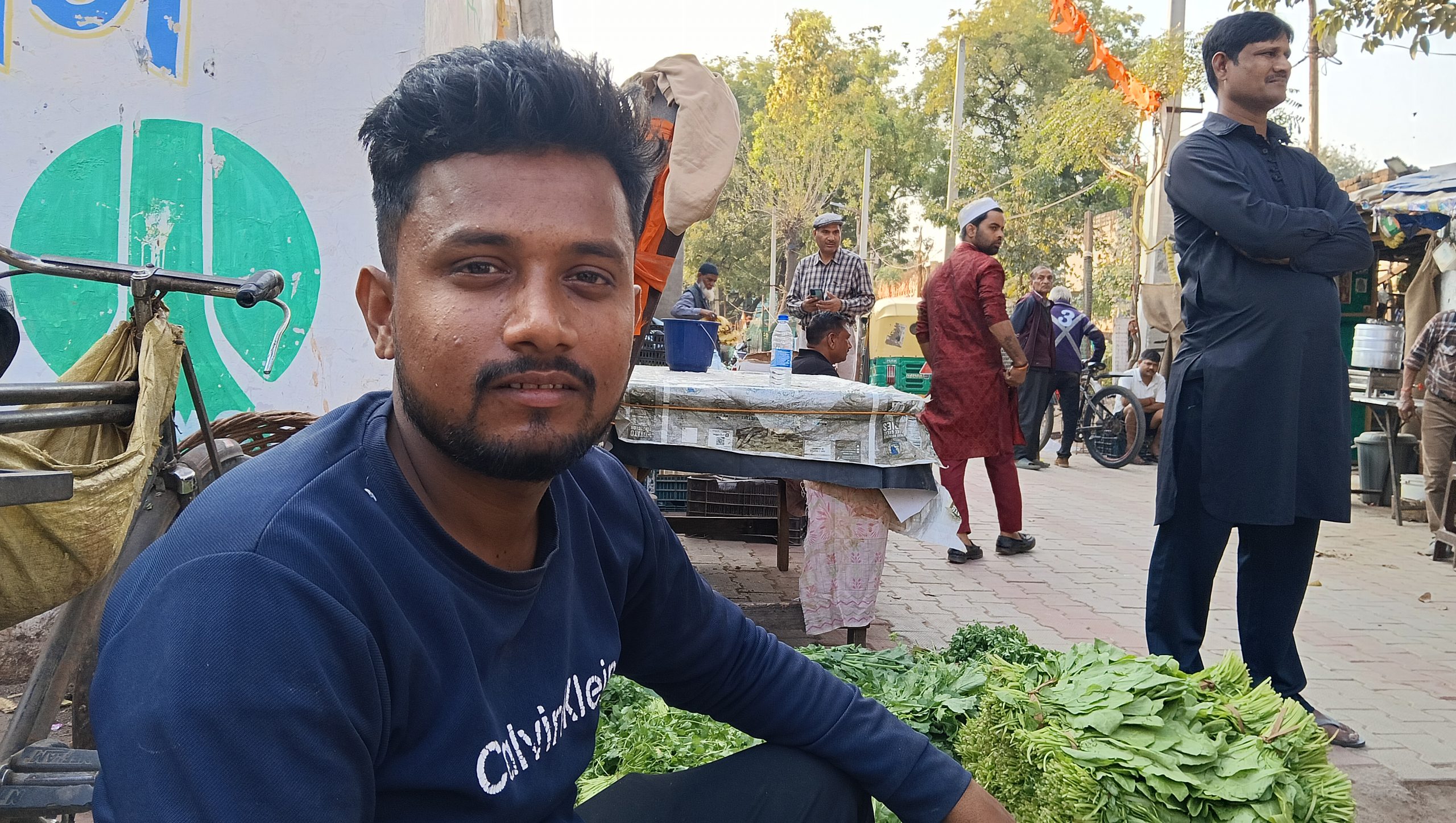 Saurav Pal, a resident and the local vegetable vendor, for the residents at Bhai Ram Camp and Masjid Camp