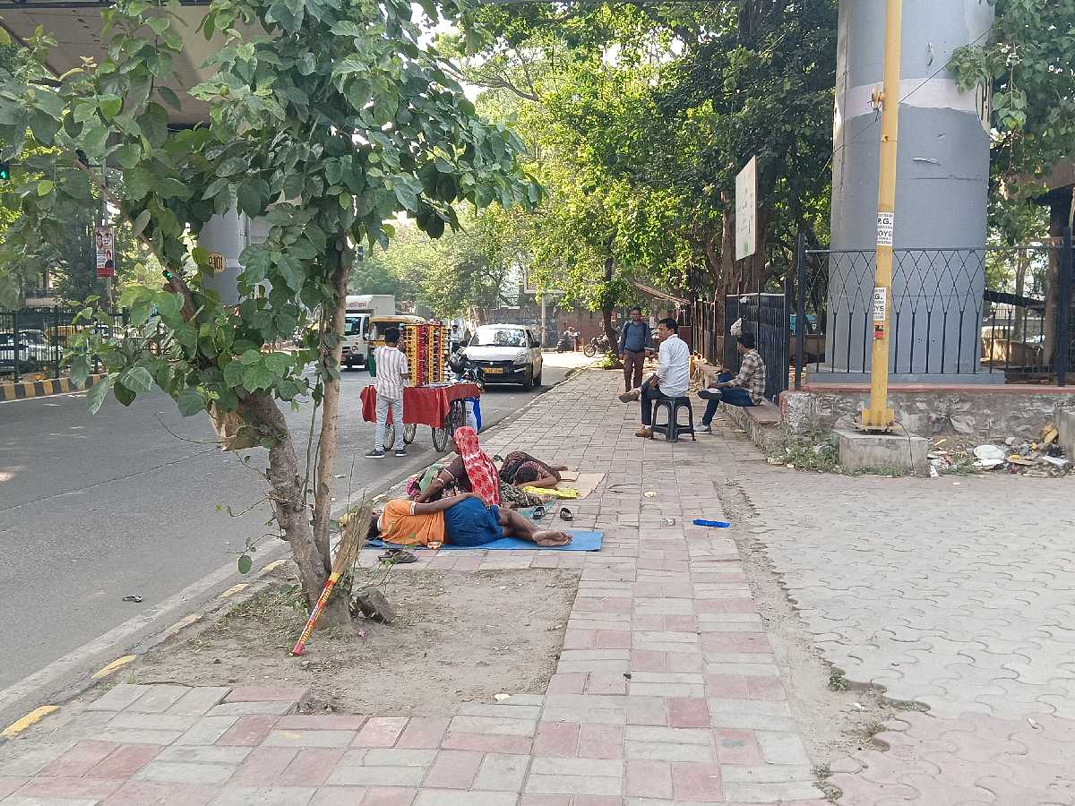 Residents at the Nehru Place night shelter prefer resting under the shade than the shelter itself