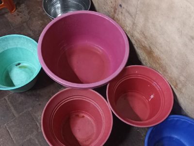 Residents collect water as supply gets more stringent