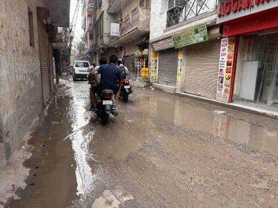 Water remains trapped on an internal road in Katwaria Sarai