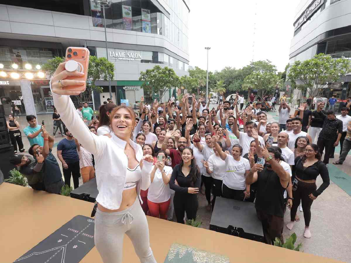 Elnaaz Norouzi clicks a selfie with participants after an International Yoga Day yoga session at Elan Miracle Mall, Gurugram, on Sunday