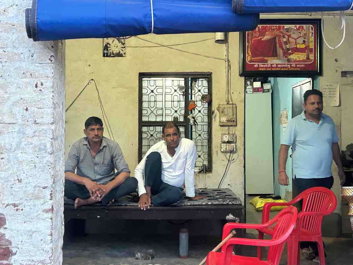 Rajesh Kumar (49), assistant supervisor, and Raj Kapoor (52), supervisor, at the gaushala in Rewla Khanpur