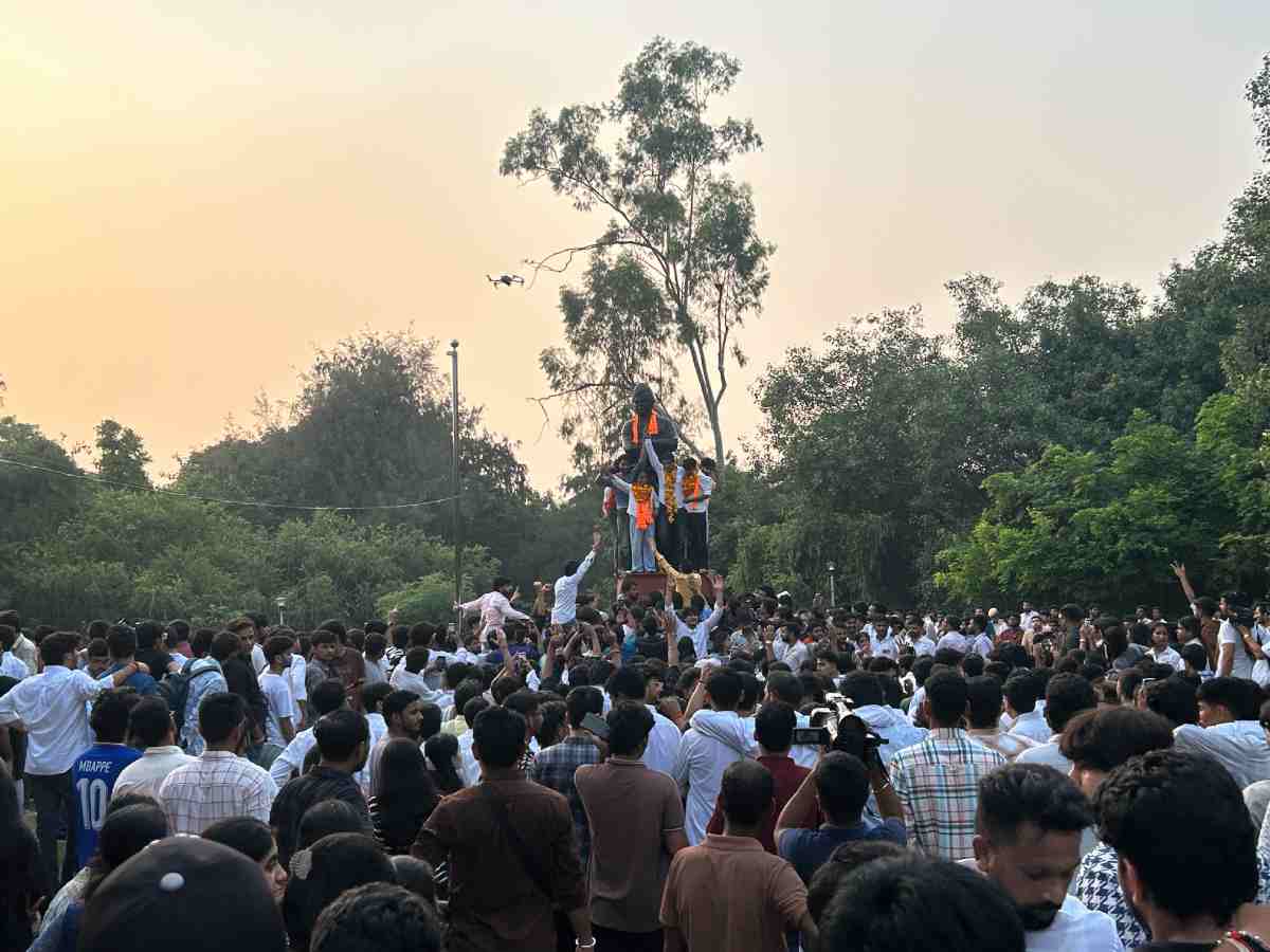 Three ABVP candidates celebrate their victory after the DUSU election results were announced
